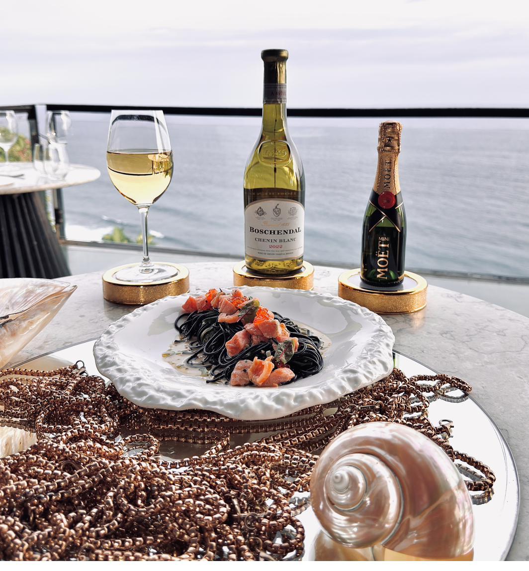 Squid ink linguine with salmon and glass balcony at Rockfish Cliffside